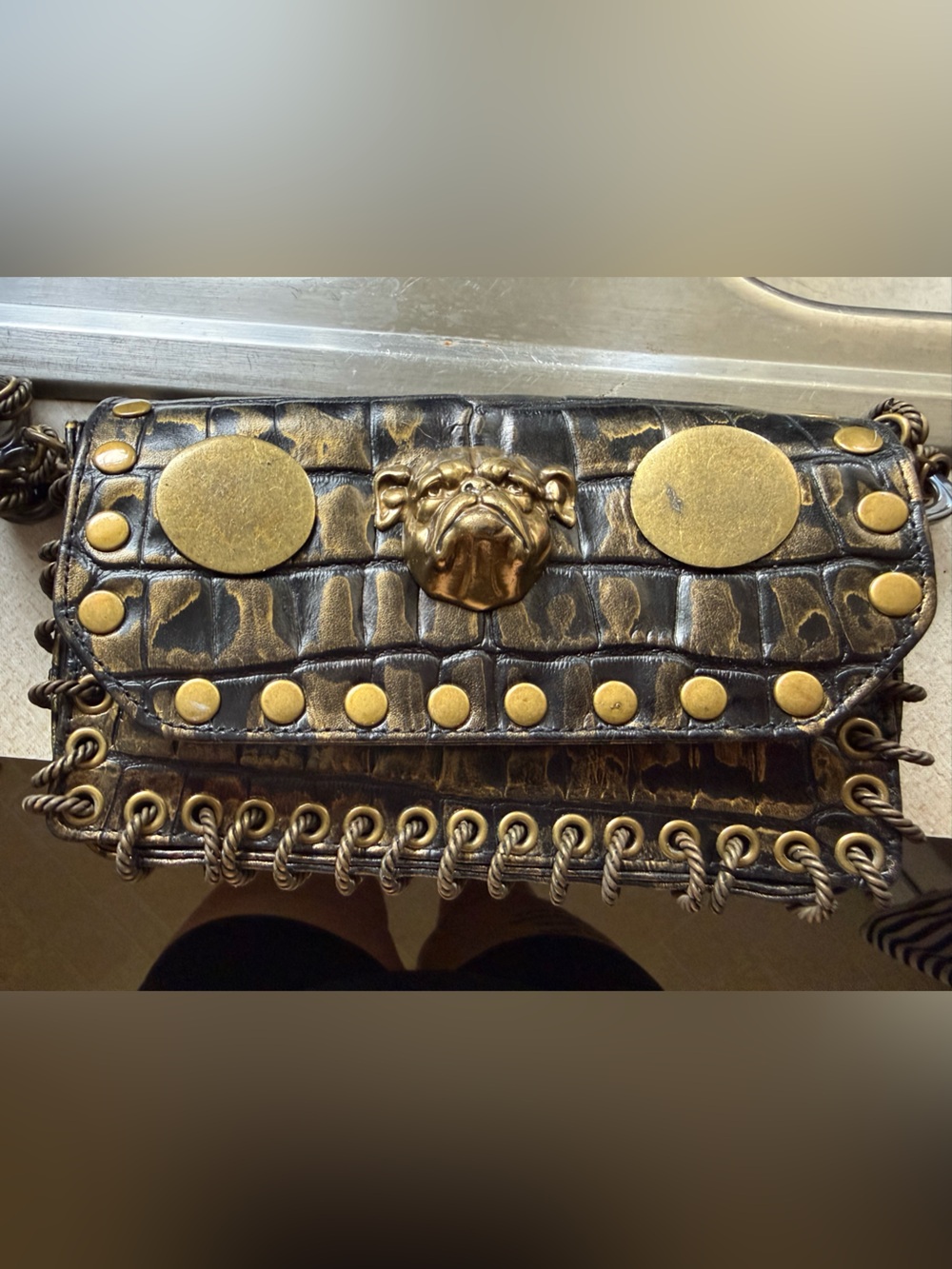 Betsy Johnson Black & Gold Studded Croc-Embossed Bulldog on the front